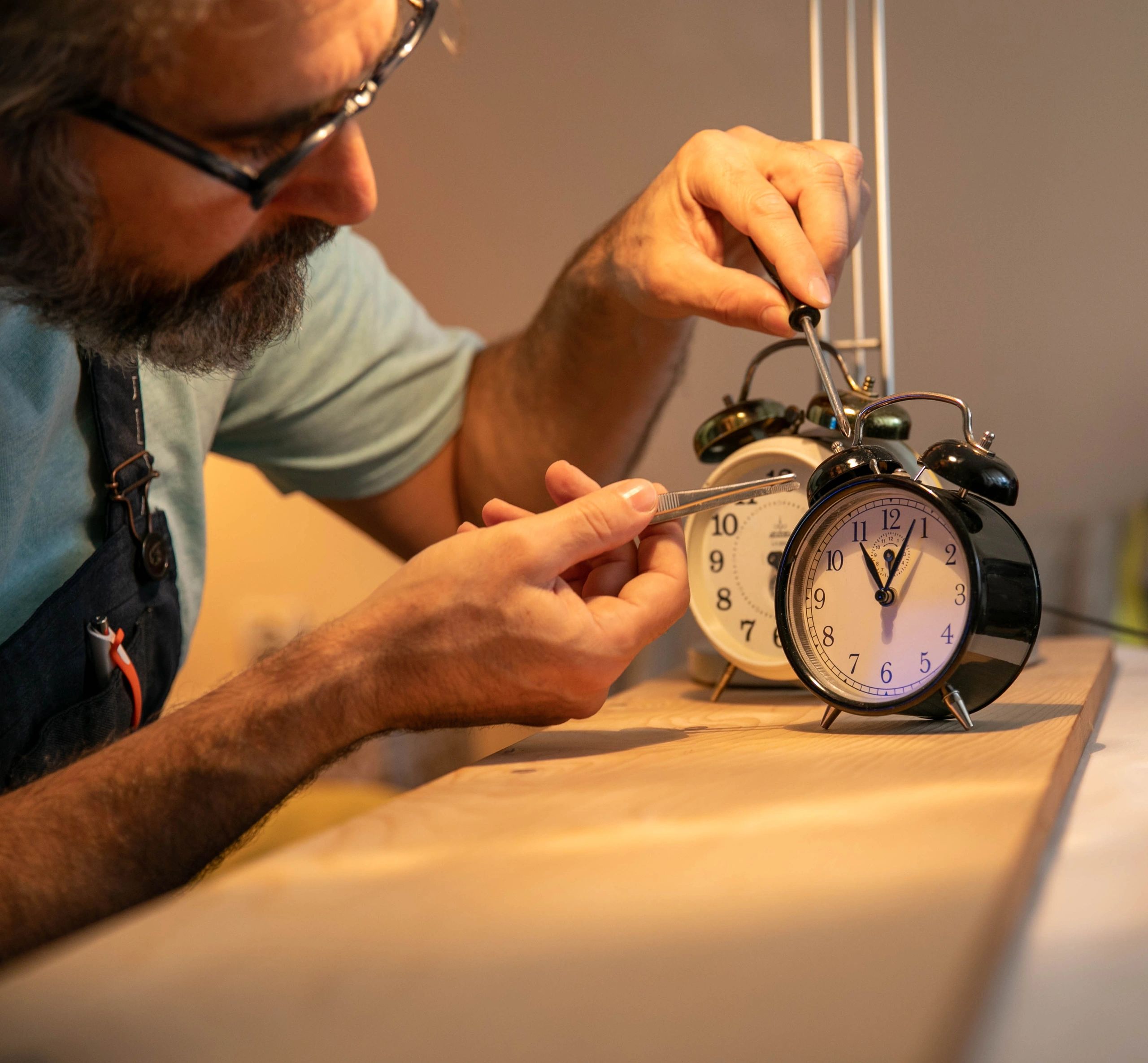 Clockmaker carefully working on a timepiece